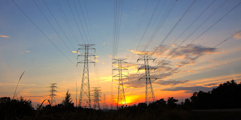 electrical utility poles and lines during sunrise