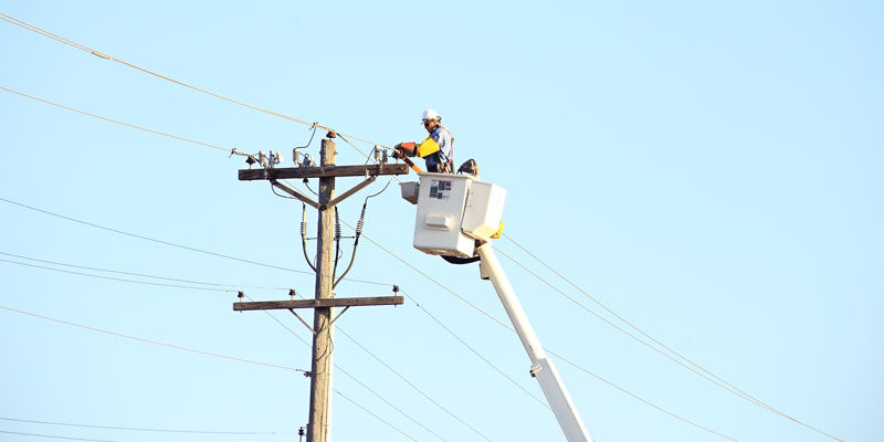 crew working on power pole and power lines
