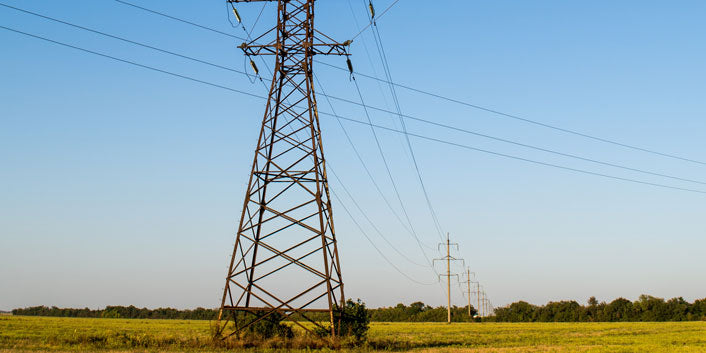 transmission lines strung between utility poles