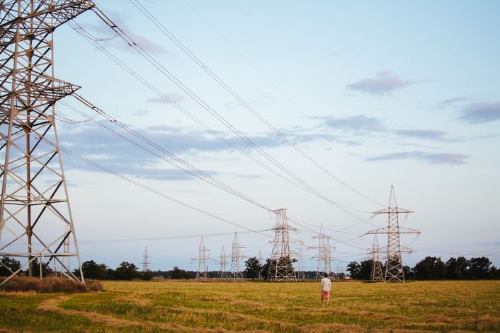 power lines and transformers delivering electricity across vast distance
