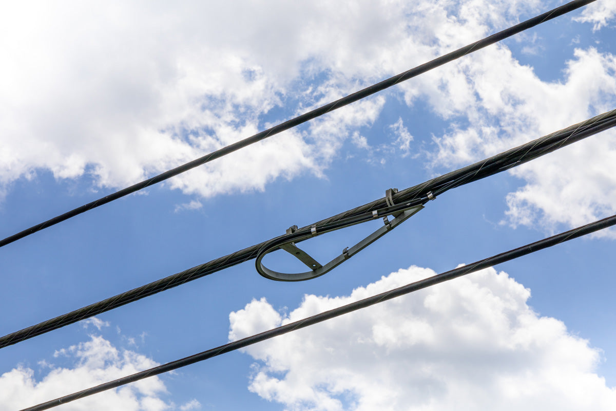 overhead cables including snowshoe fiber optic bend limiter