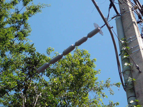 line guard for triplex on power line near trees
