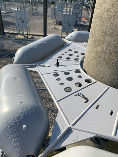 close up of pole guard installed on steel utility pole